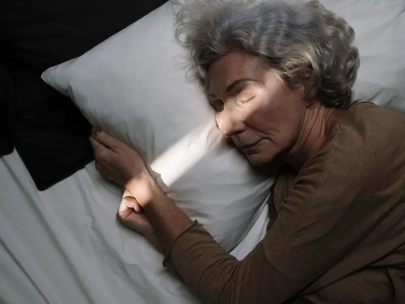 A woman sleeping peacefully in soft morning light